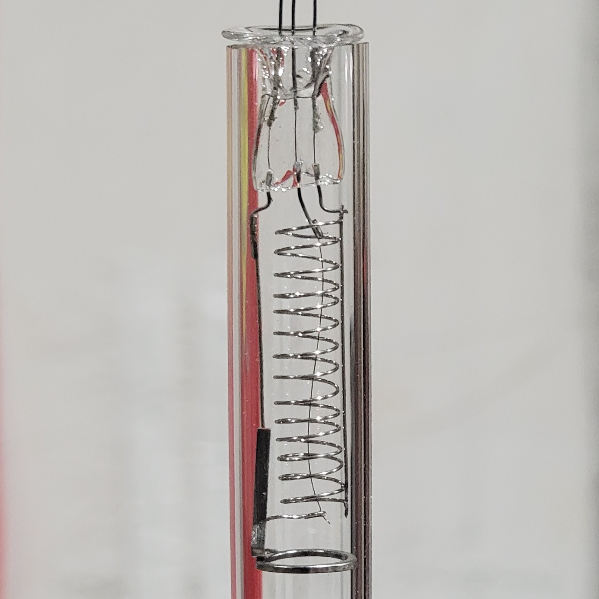 The tube base assembly sitting in a piece of tubing such that the flare sits against the open face of the tube